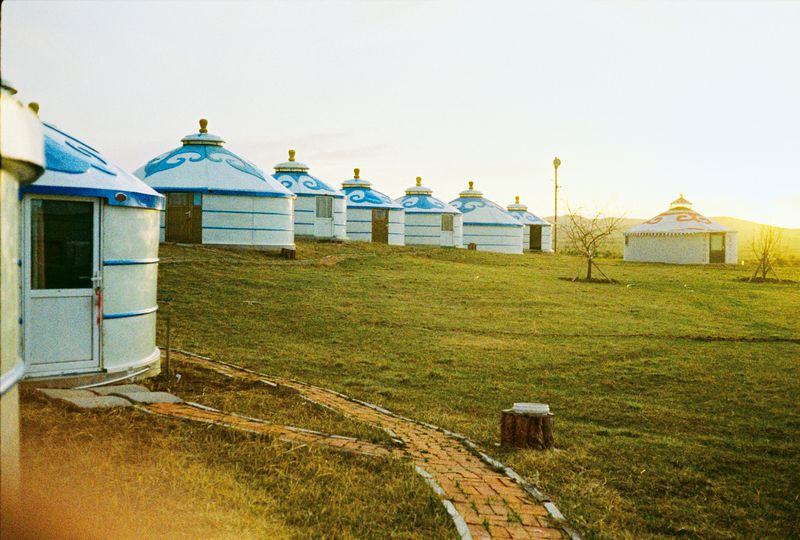 Concrete and wood versions of traditional Mongolian ger (yurts) accommodate tourists on Hebei’s grasslands