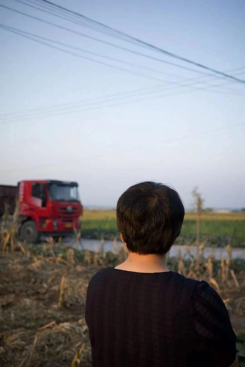 Han Shimei, a poet from a small village stares into the fields, female poet in rural china