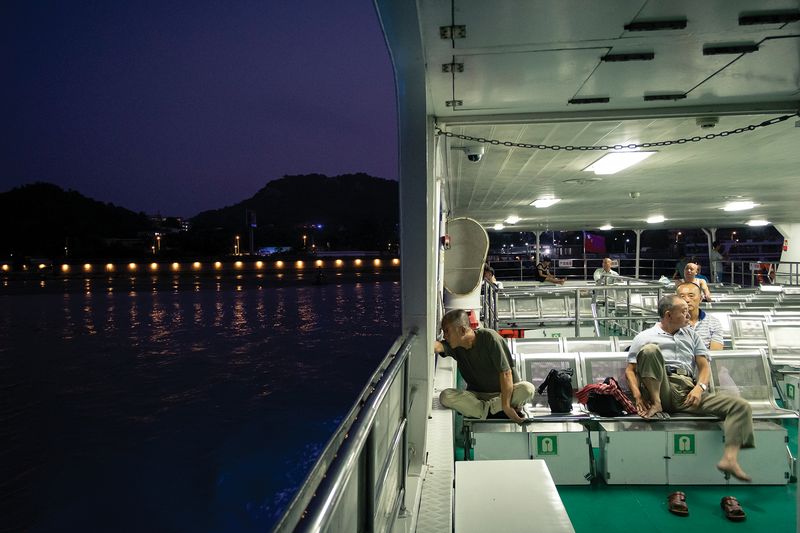 Passengers are few on the last ferry of the day between downtown Shantou and the suburban Haojiang district