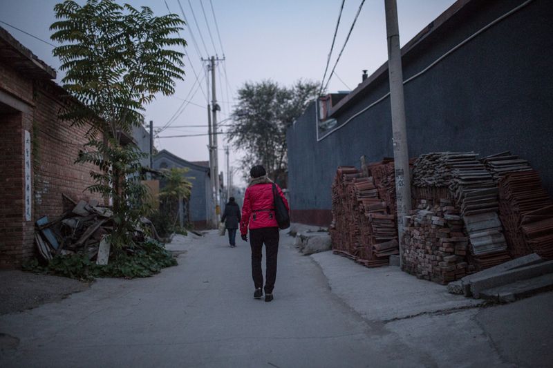 Sister He, one of China's aging migrant workers who is struggling to make ends meet