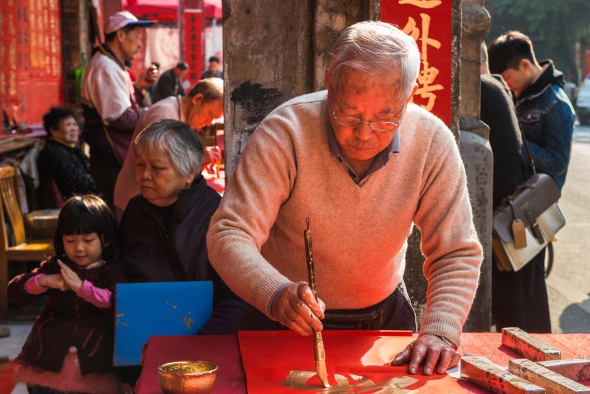 Calligrapher at a street stall in China during the New Year, Preparation for the Lunar New Year