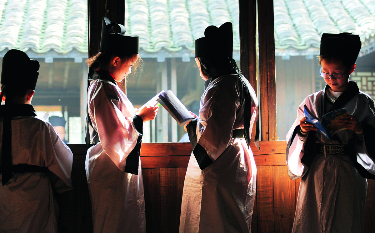 Children recite Di Zi Gui and the Three-Character Primer at a primary school in Zhejiang province