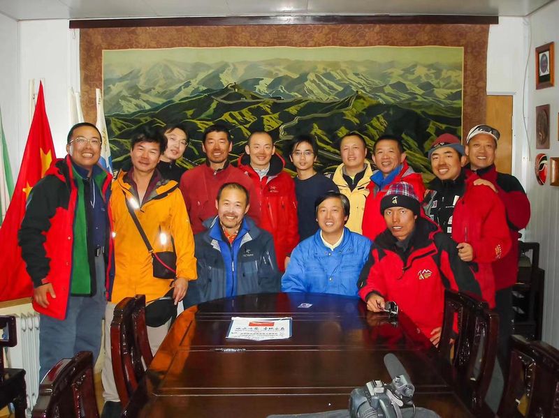 Team members at China's Great Wall Station posing with businessman Wang Shi