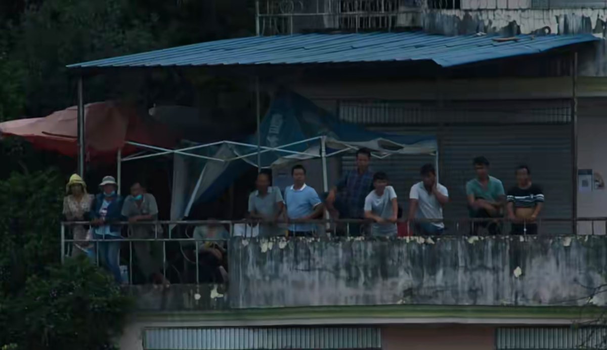 Villagers hiding on the second floor of their house before the elephants’ grand entrance