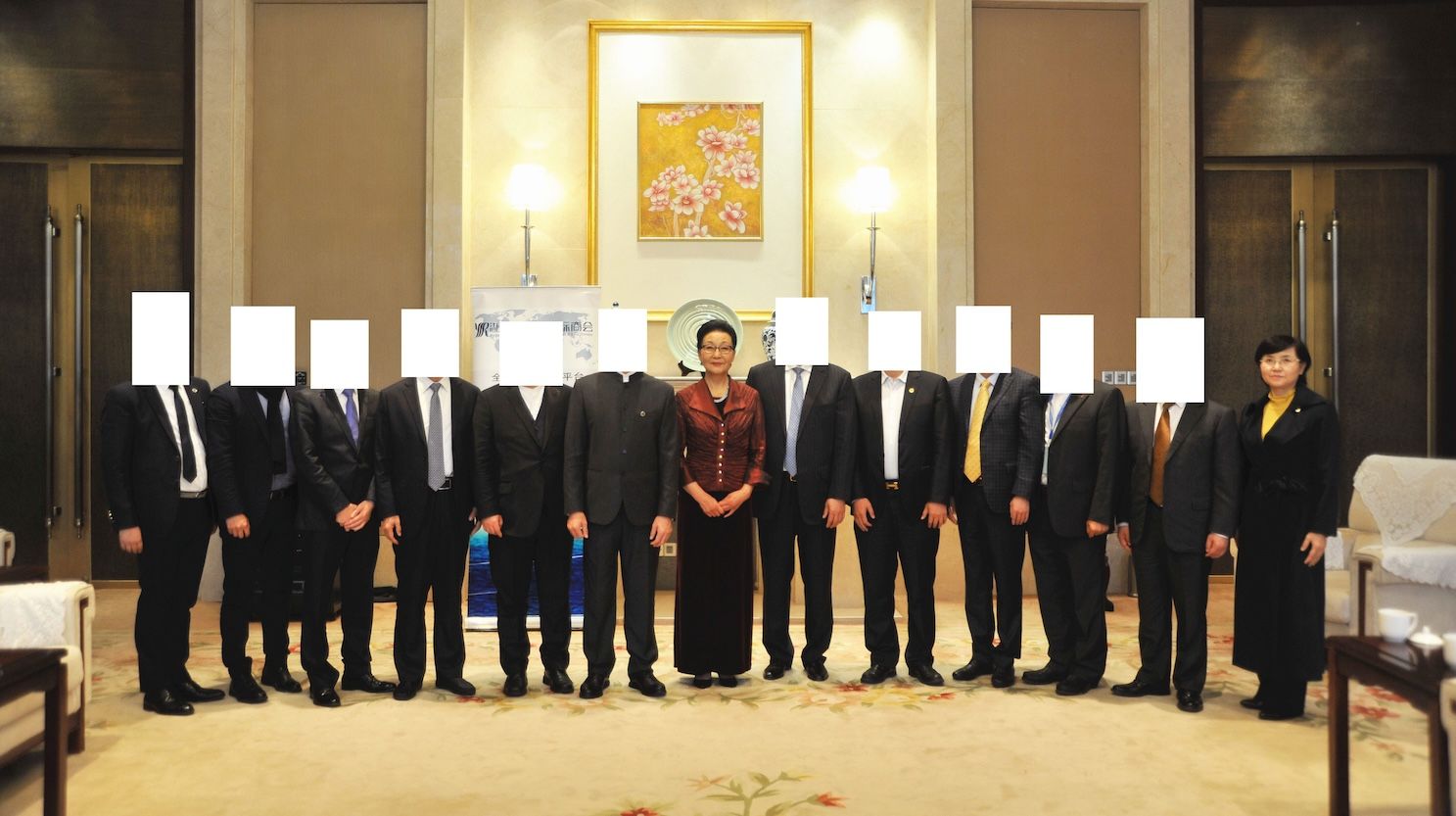 A group photo where men's faces are covered by a white squares, Yan Jiacheng "Group Photo Searching"