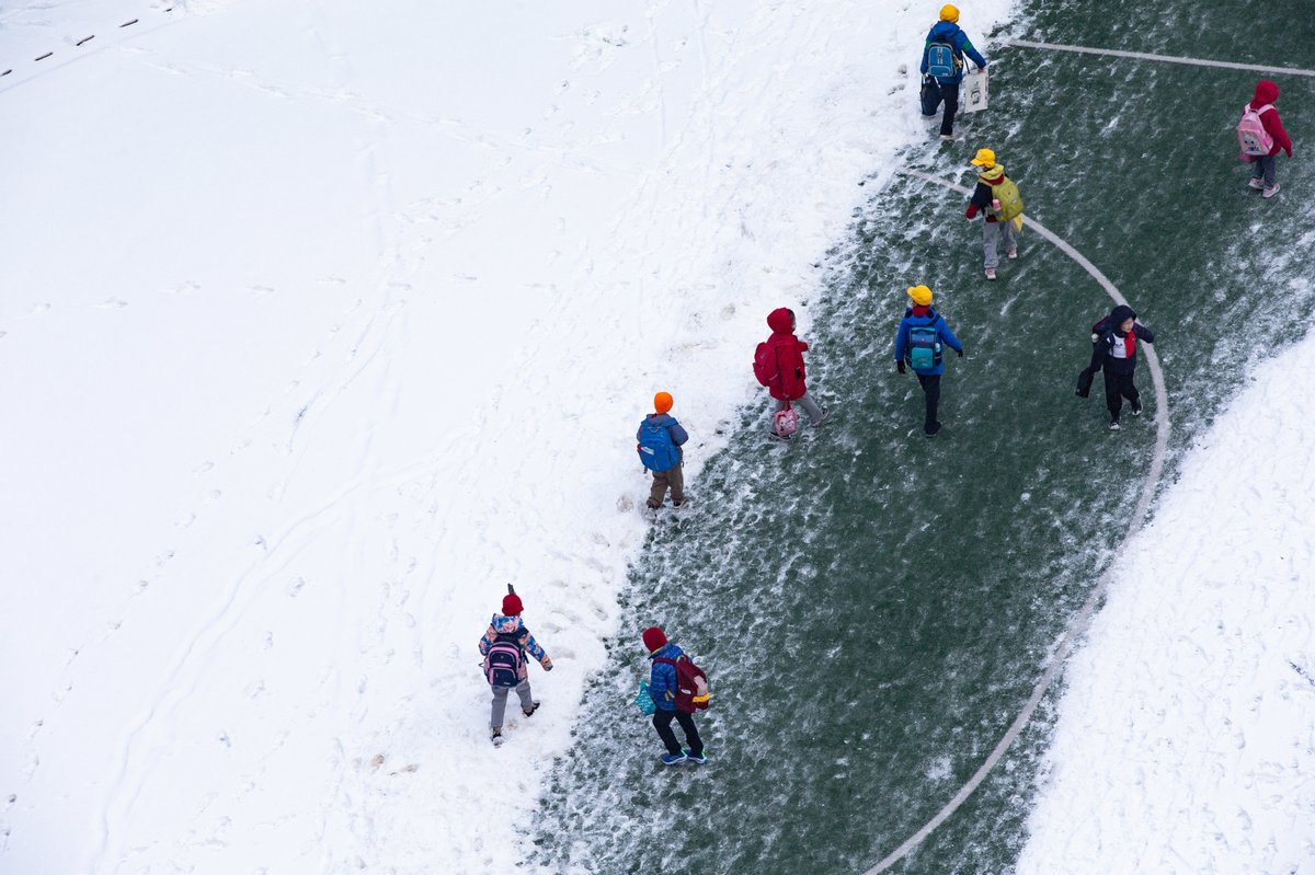 Students walking on the iced road