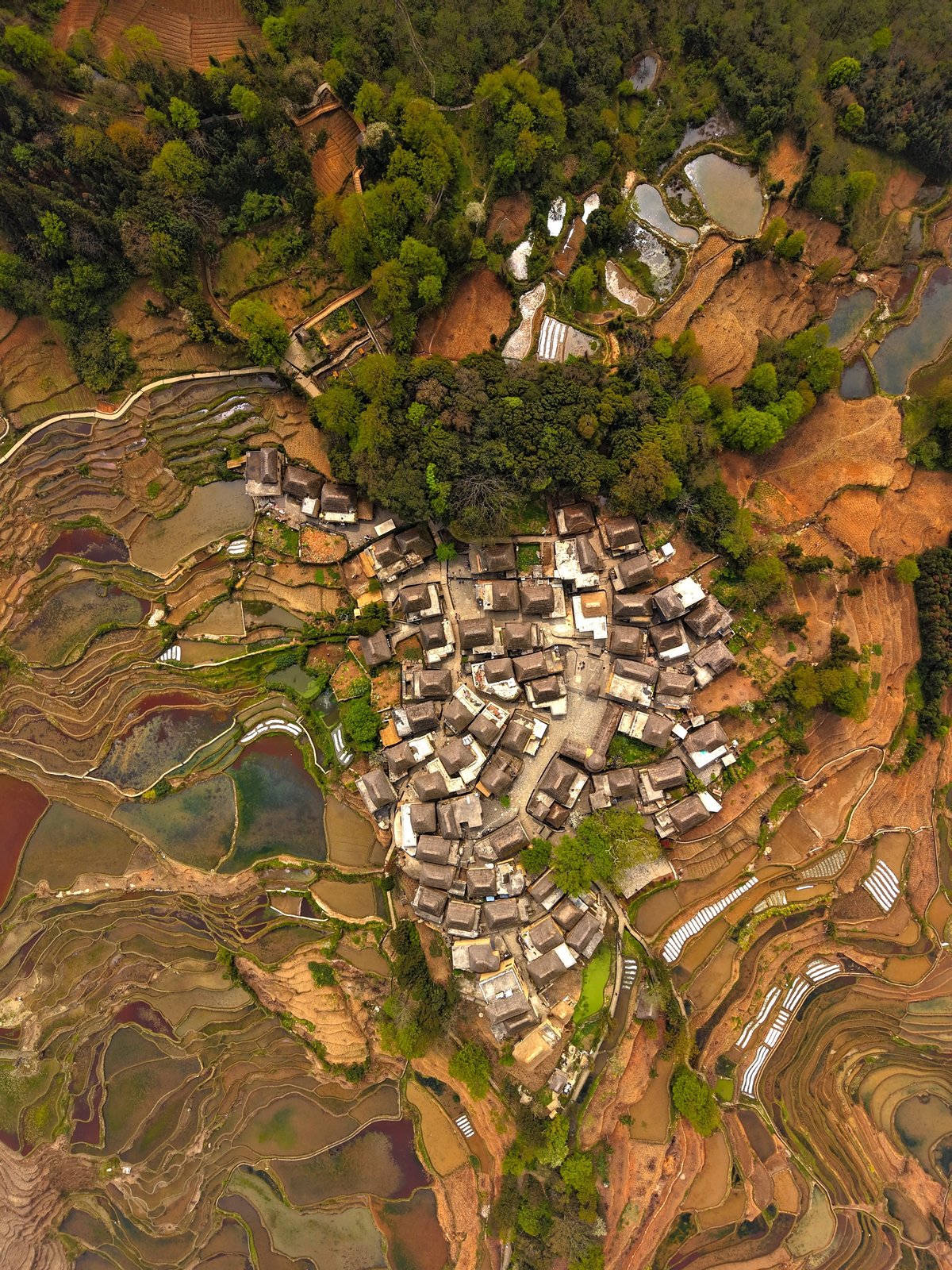 Aerial view of the “Best Tourism Village” Azheke Village in Yuanyang County, Yunnan