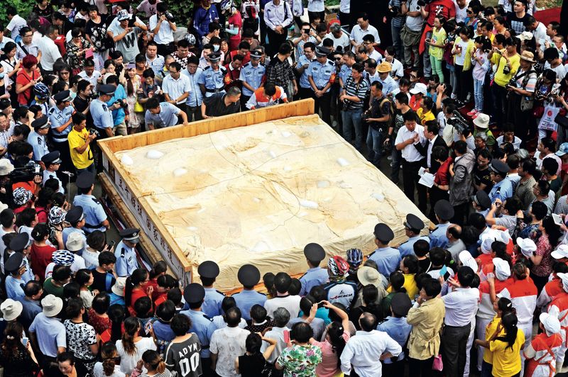 A giant, eight-ton piece of tofu is unveiled at the Bagong Mountain Tourism Festival in September, 2015, the birthplace of Chinese tofu