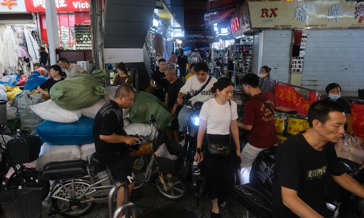 Scooters are the best means of transportation on the narrow roads of Kangle village, even for delivering the fabric from the Zhongda Cloth Market to the factories