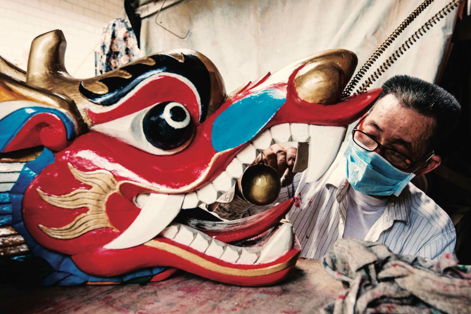 Detail is carefully added to the finely carved figurehead