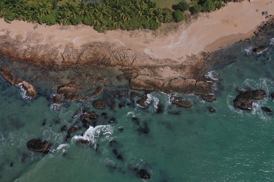 One of the many rocky beaches along the coast of Hainan.