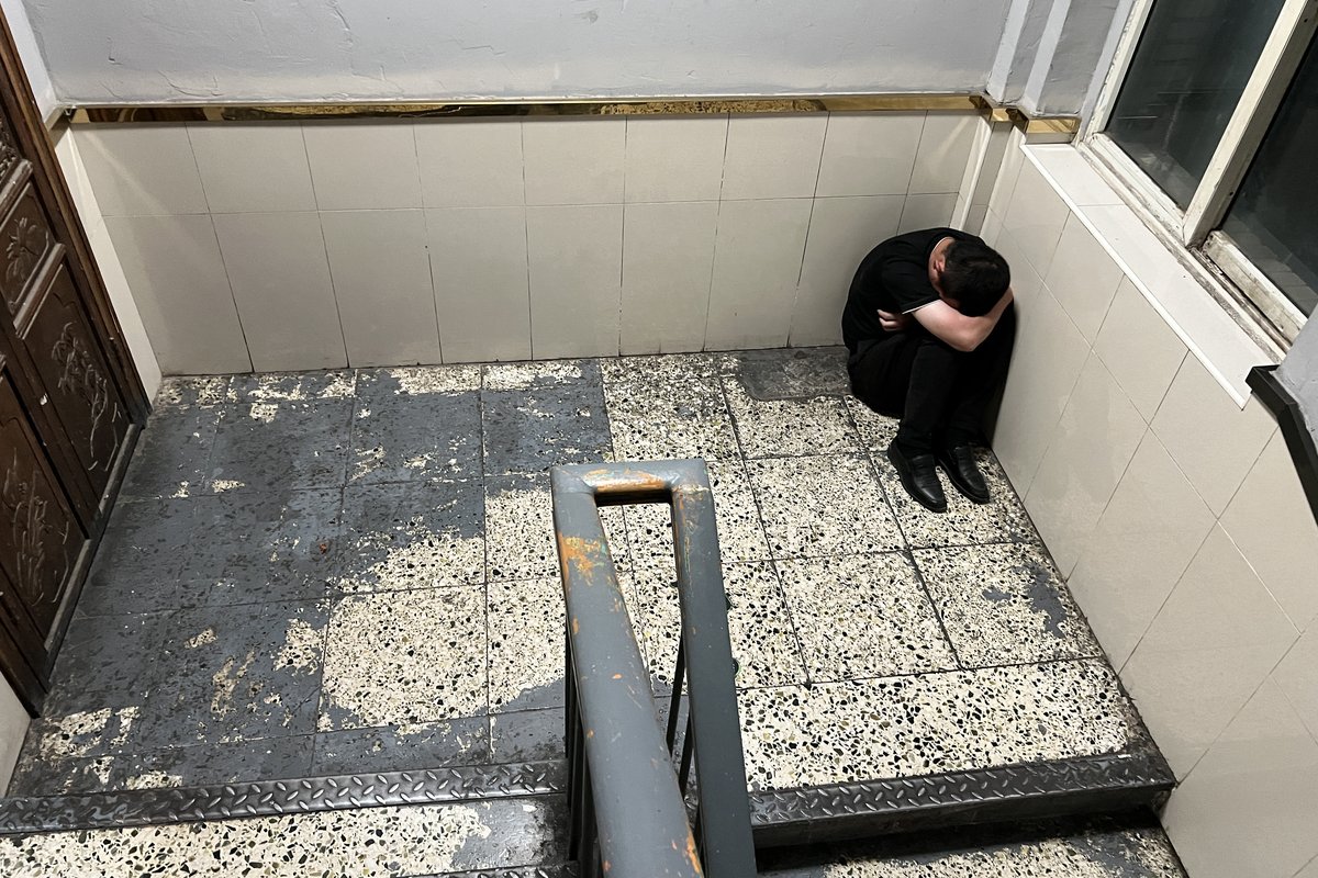 Man sleeping near a stairwell