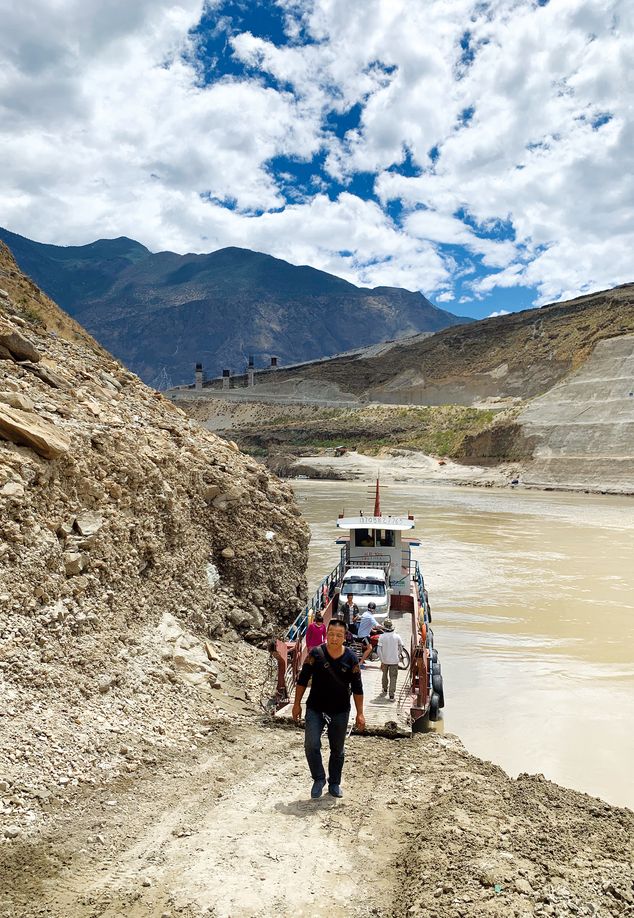 The ferry crosses the Jinsha River north of Tiger Leaping Gorge, and can only carry a few vehicles as it navigates the currents