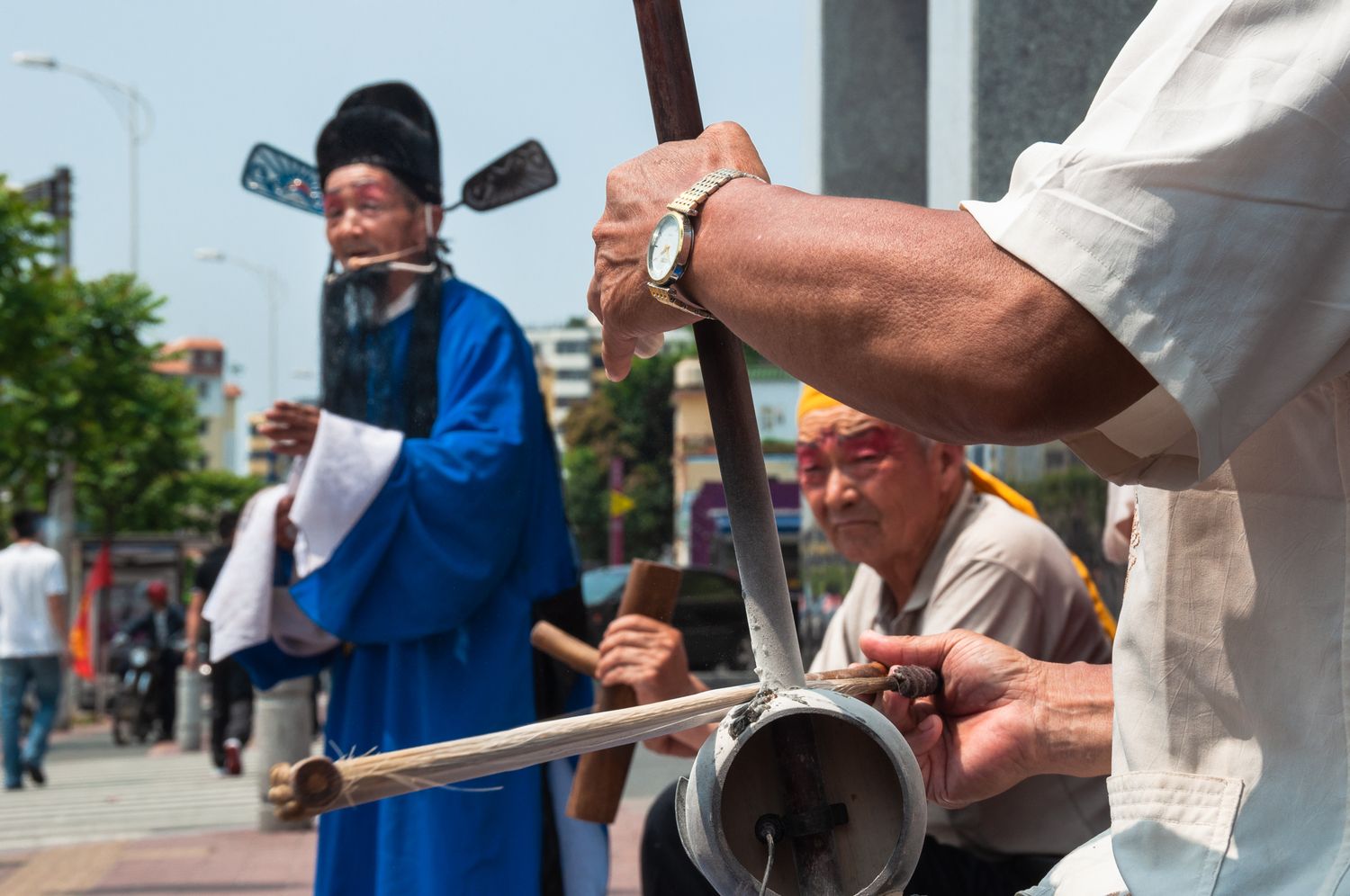 A Henan opera singer performing on the street of Guangzhou with his band. With theatergoers decreasing in number, many traditional opera singers turn to alternative venues. (2012)