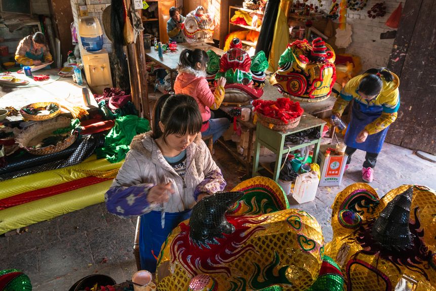 Employing 15 workers, a factory specializes in making lion dance costumes and drums runs a thriving business in Dalang Village, Guangdong province, with the art form widely practiced in the Pearl Rive