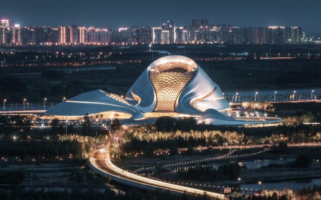 Inside the Harbin Grand Theatre , is also futuristic auditorium seating covered with wood paneling.