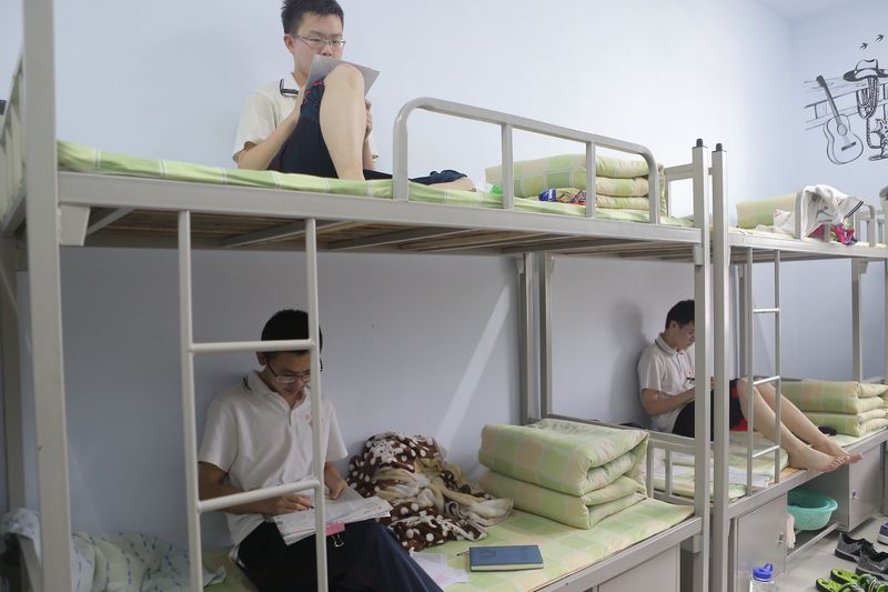 Students studying in their dorm room during afternoon nap time