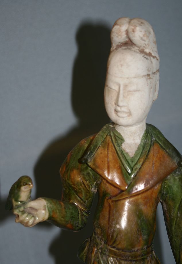 A Tang dynasty porcelain maid and parrot, learn more on parrots in ancient Chinese literature