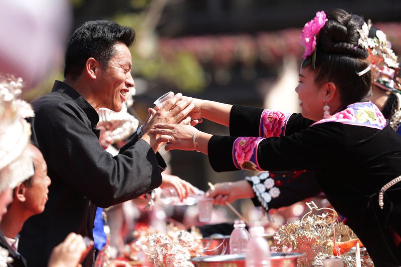 Newlyweds toast their guests at a wedding in Sichuan province. At many celebrations around the country, especially in rural areas