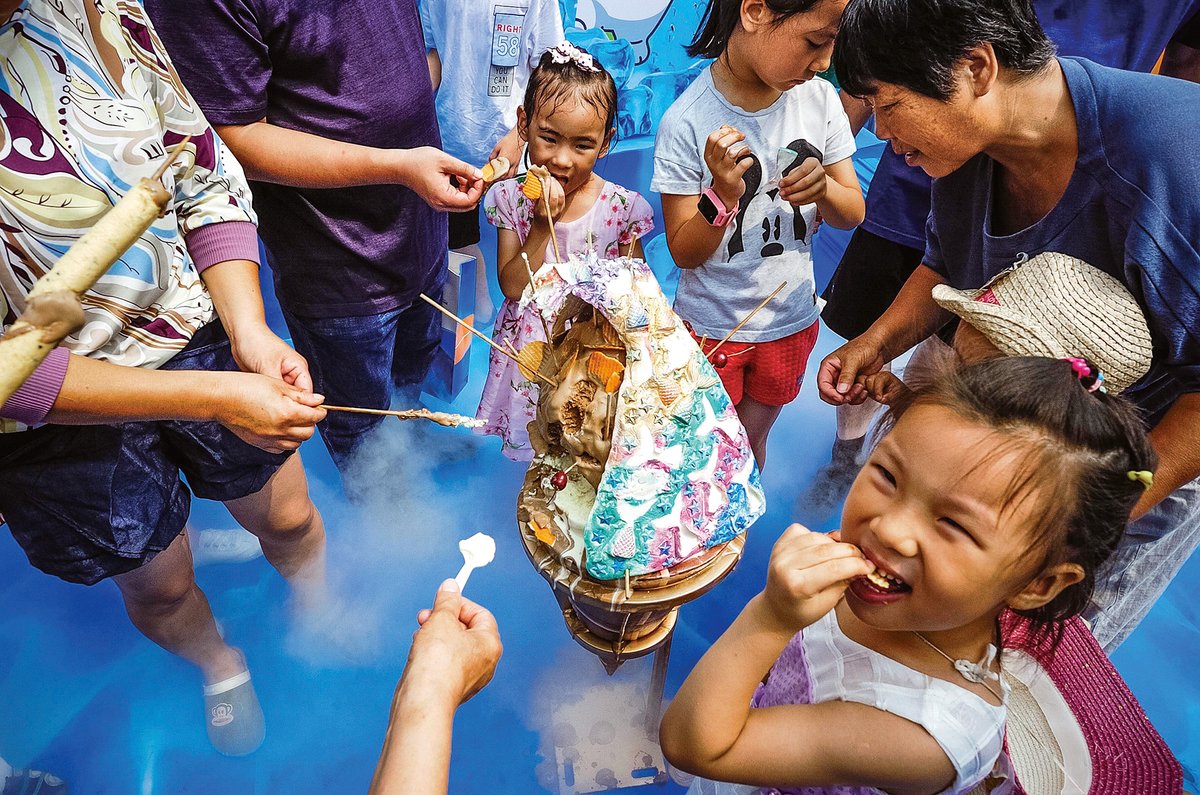 Young Chinese kids enjoying some sweets