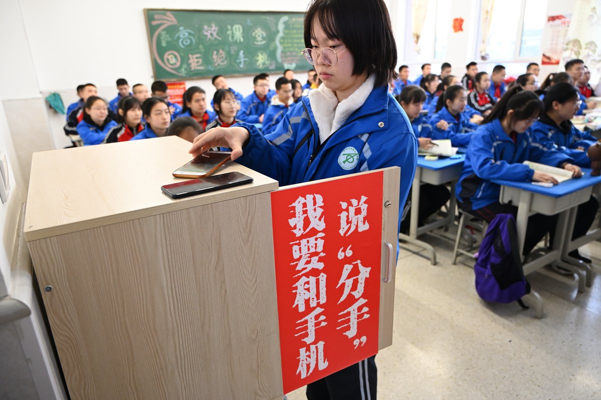 A middle school student put her phone in cabinet as school required