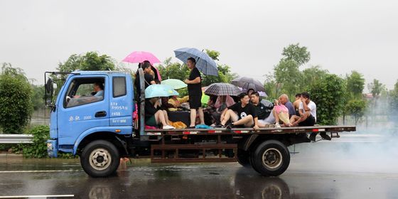 Zhengzhou residents on back of truck