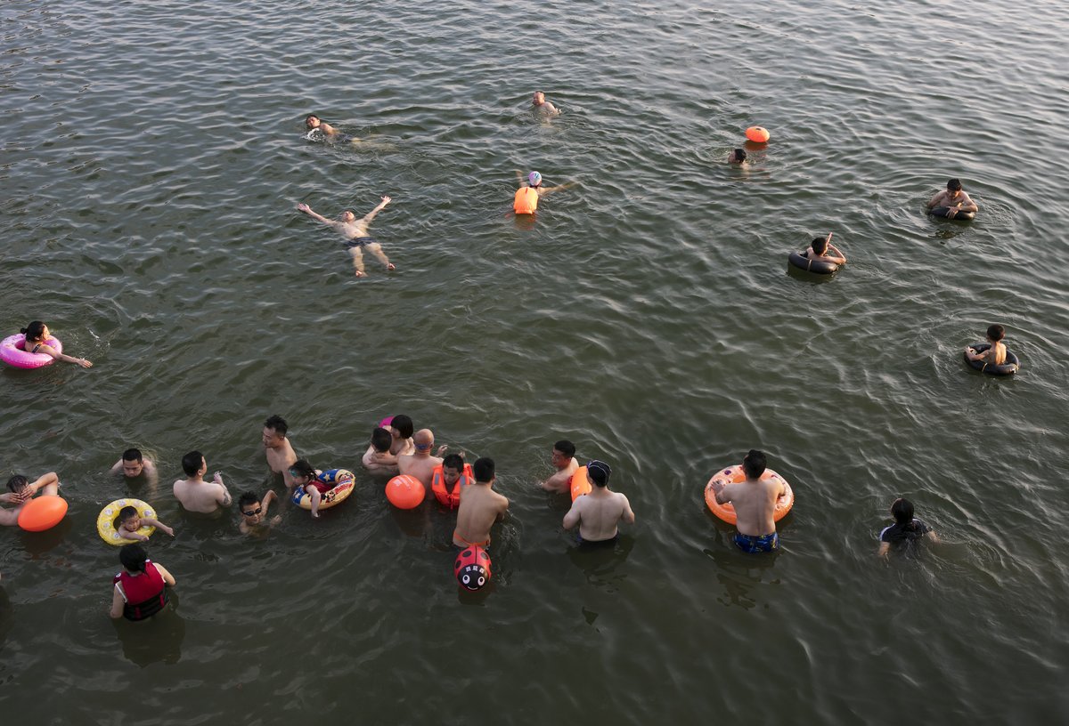 People swimming in water