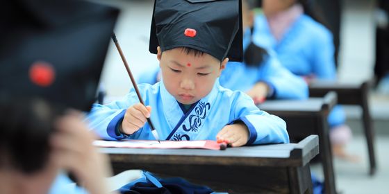Young student in Shanghai learning penmanship