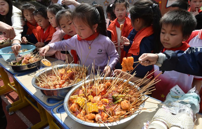 A school in Chongqing, a municipality in southwestern China known for its spicy cuisine, incorporated malatang tasting into a school activity, china's most popular dish-meal