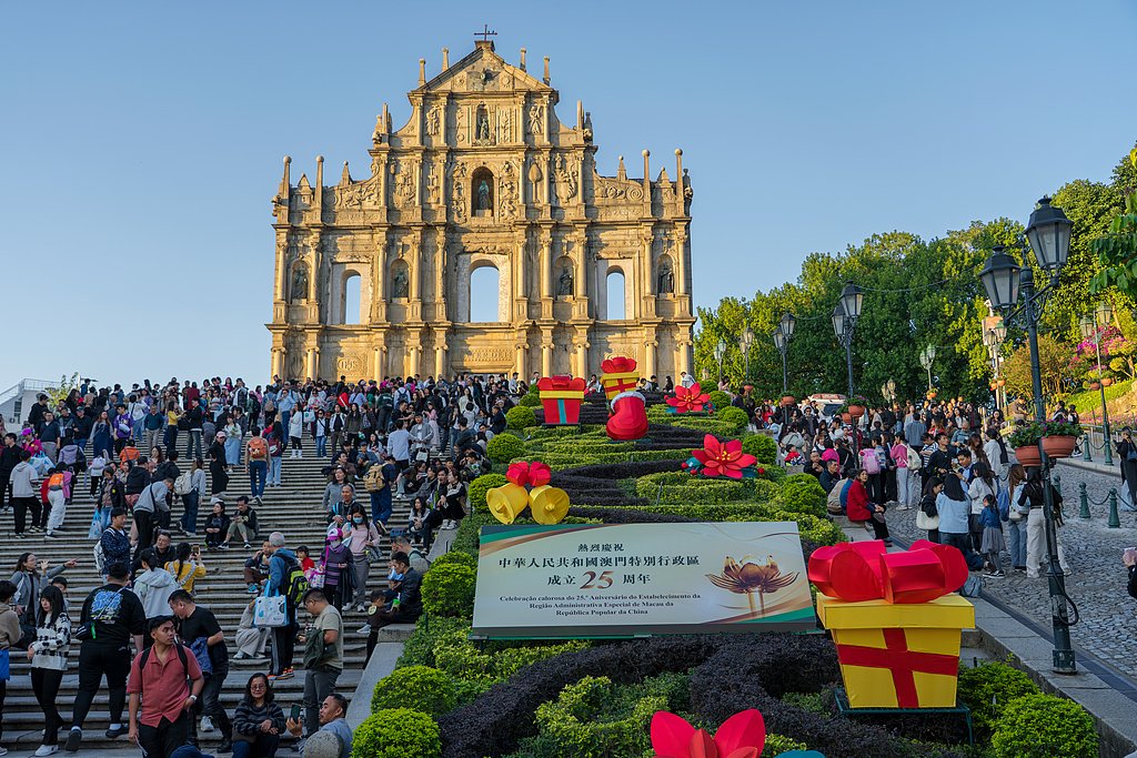 Macau, a former Portuguese colony, celebrates the 25th anniversary of its return to Chinese administration this December. Its iconic Ruins of Saint Paul are adorned with Christmas decorations