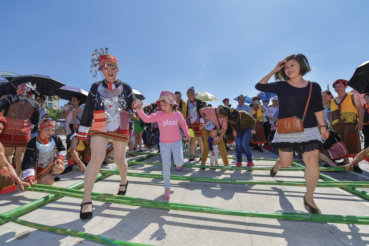 A traditional bamboo stick dance at the Sanyuesan festival in Qiongzhong Li and Miao Autonomous County