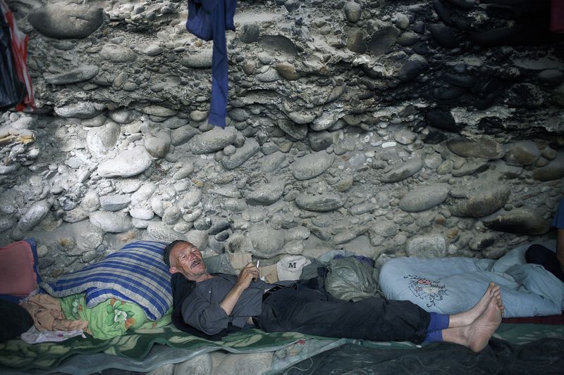 A jade miner in Hotan taking a break in the mines