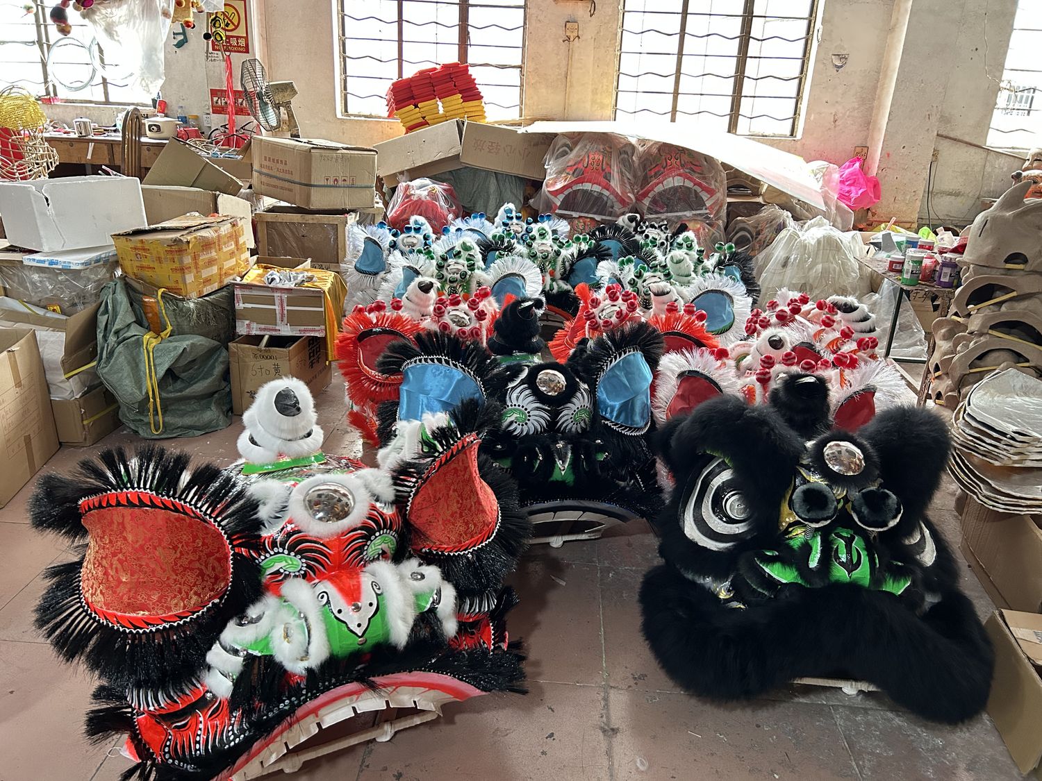 Artisan constructs the head of a Chinese dancing lion