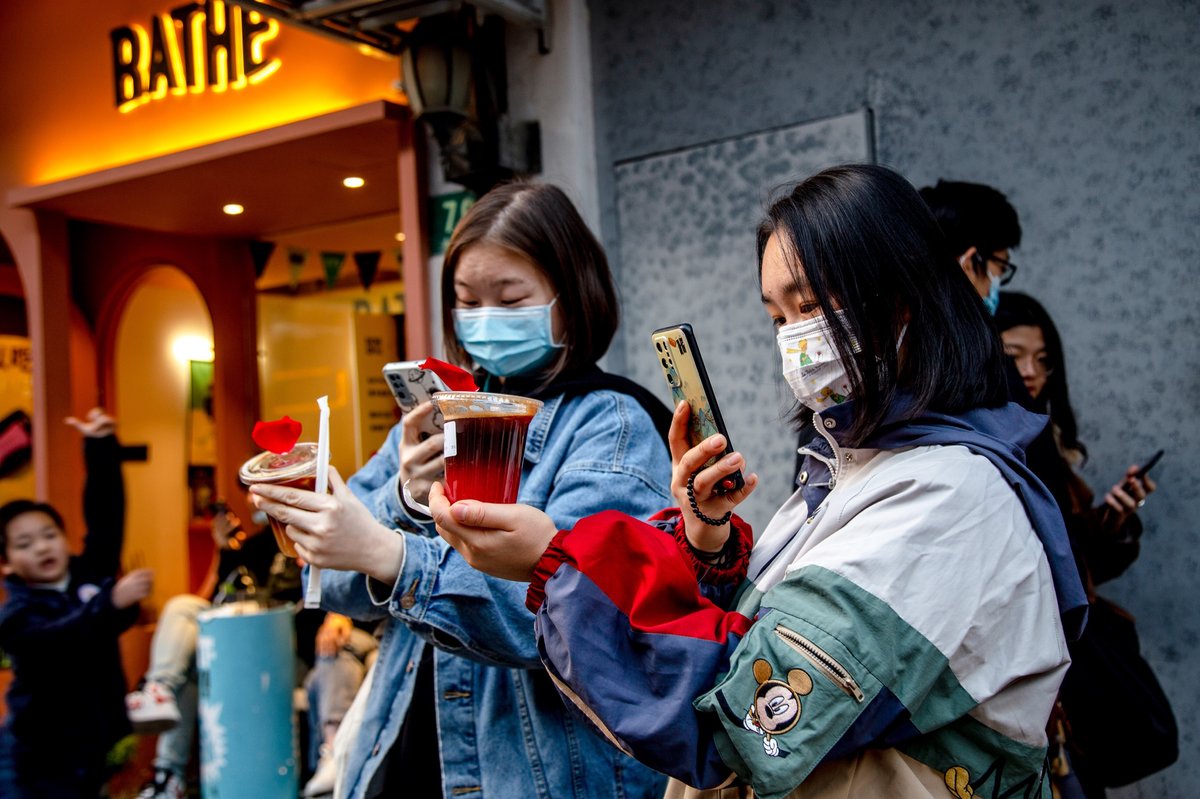 Two girls taking photos in the internet famous shanghai neighborhood