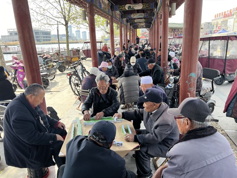 Chinese seniors in Caoxian playing games and socializing