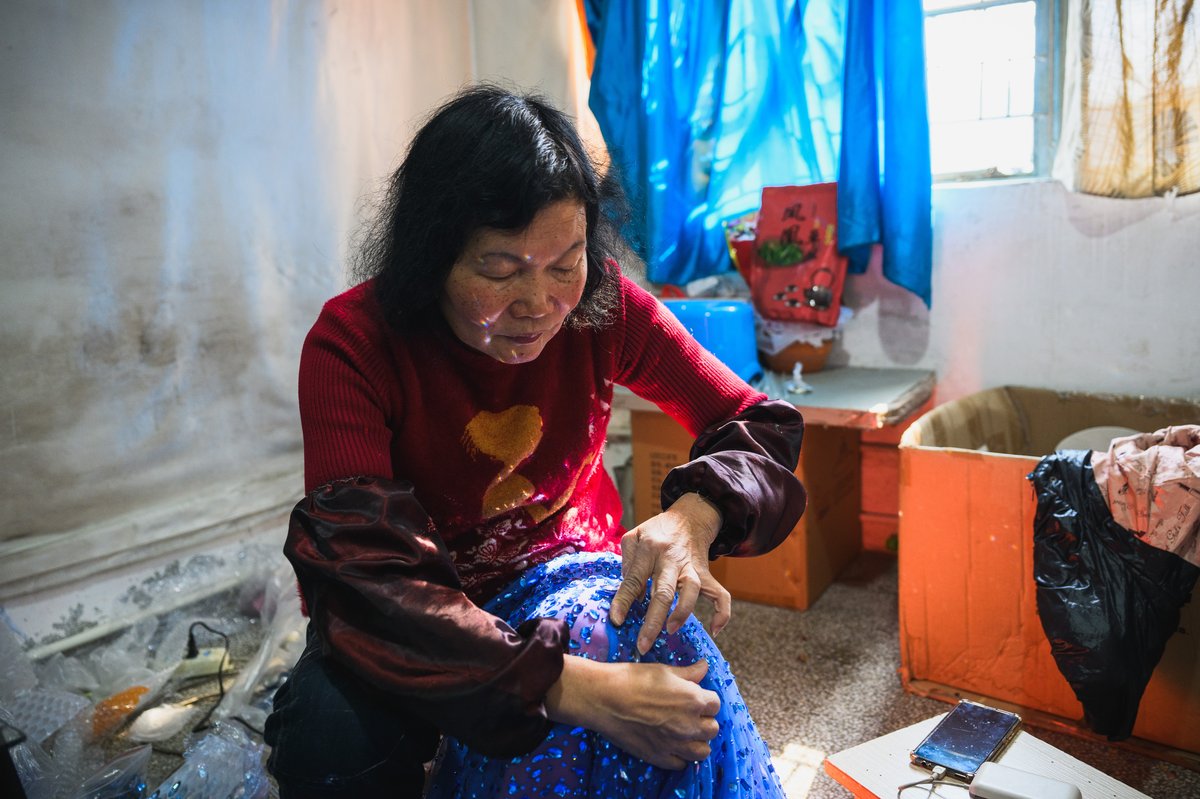 60 year old Chen Xiuling one of the few remaining seamstresses skilled in Chaozhou embroidery