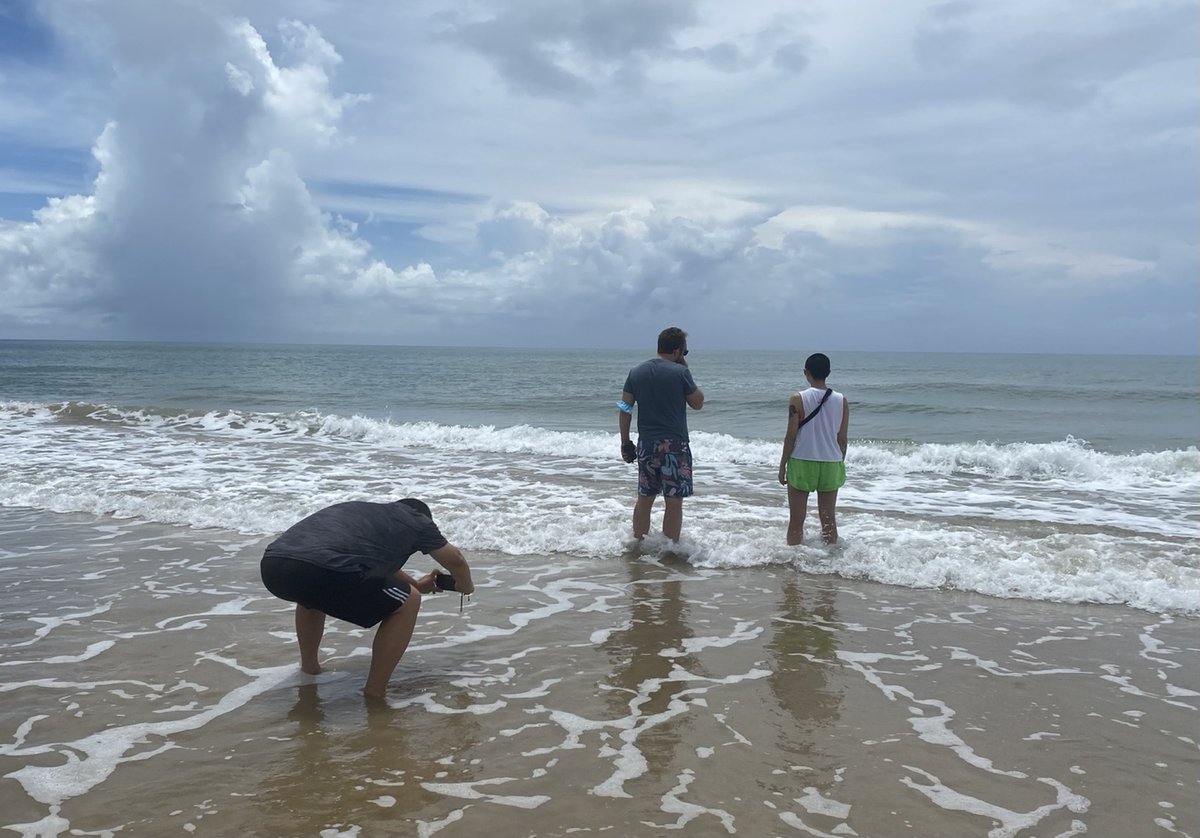 On a beach in Hainan, pondering our next plan to leave the island and taking photos, as Covid restrictions ramped, stranded in Sanya