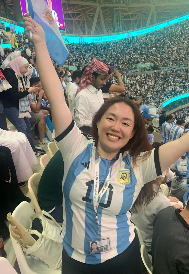 A Chinese soccer fan wearing an Argentina jersey