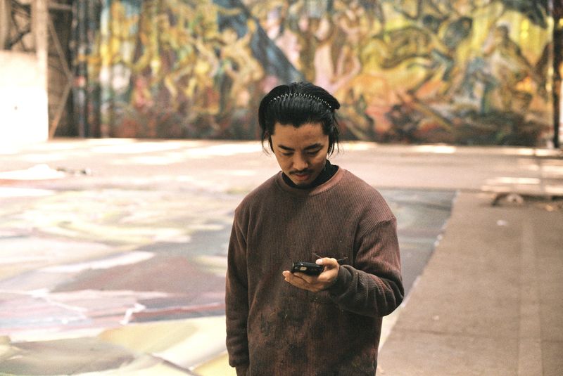 Shuare, an Yi ethnicity artist in China, often works on multiple paintings at the same time