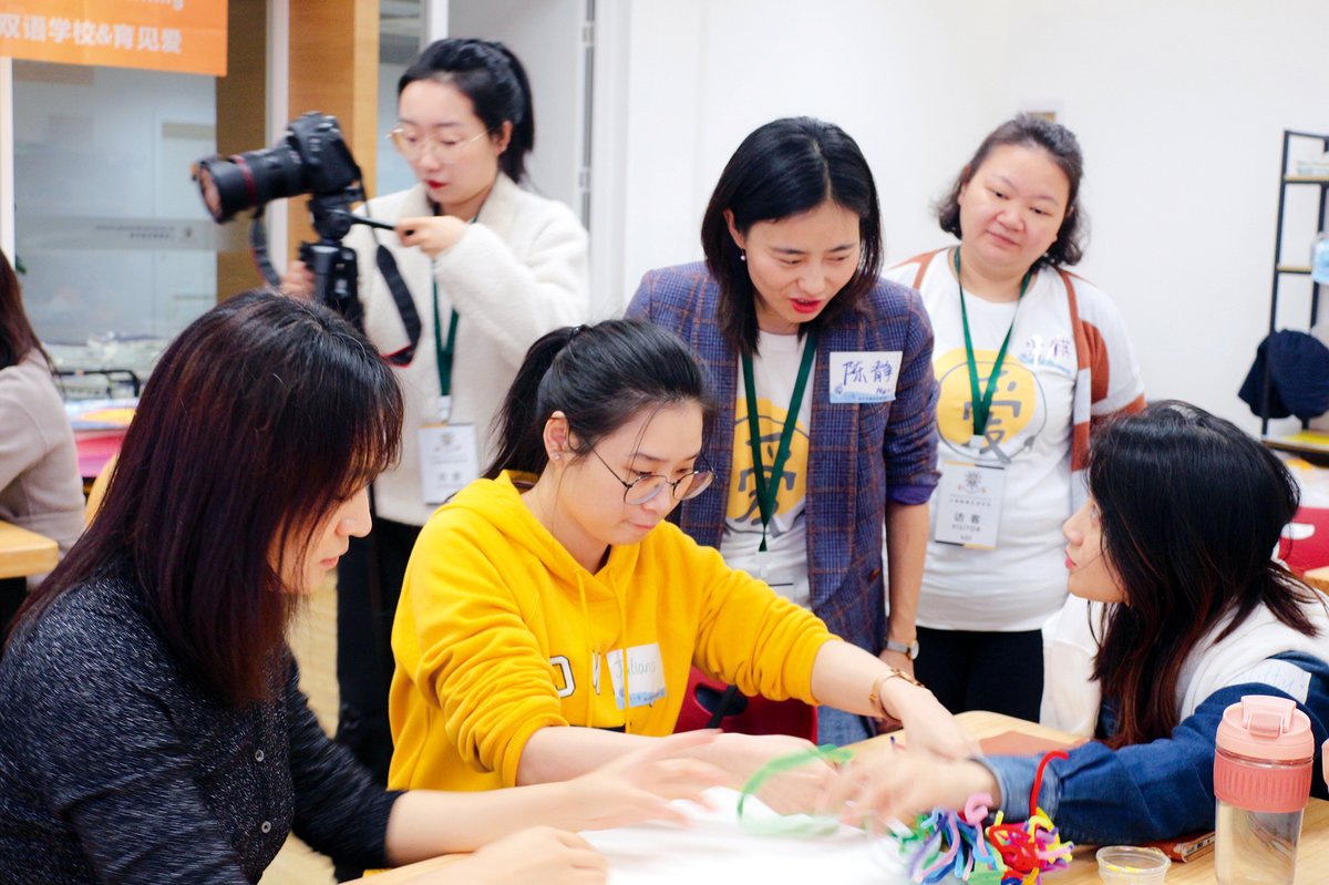 Evolving-I’s Chen Jing working with parents at a bilingual school in Shanghai