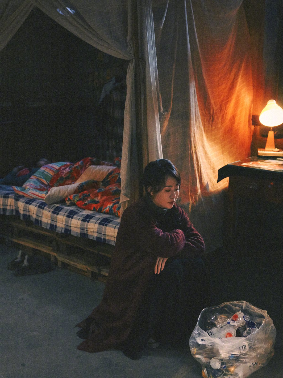 A Chinese woman next to a lamp, from the new hit Chinese comedy Zhua Wawa