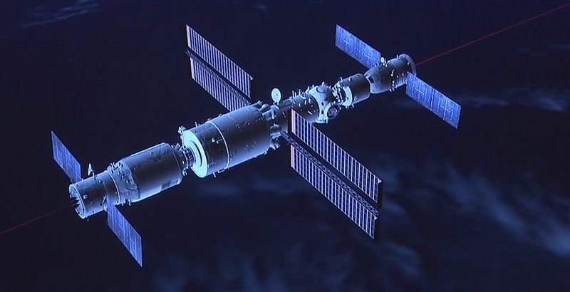 A computer-generated image of the Chinese Space Station from CCTV’s live-stream program. The Shenzhou-12 is docked at the front (right side), and the Tianzhou-2 cargo space ship is docked at the back