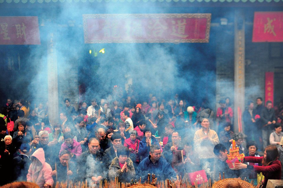 Daoism influence in China is strong as Chinese people in Guangzhou go to light incense and celebrate the Lantern Festival.